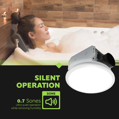 Woman relaxing in a bath with Whisper Quiet Bathroom Exhaust Fan With Integrated LED Light Ceiling Mount 50 CFM Ventilation 0.7 Sones White Finish Low Noise Bath Fan for Small Bathrooms and Powder Rooms displayed
