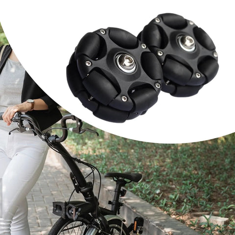 Omni directional folding bike wheels for easy maneuvering and portability, shown with folding bicycle for outdoor modding and upgrades.