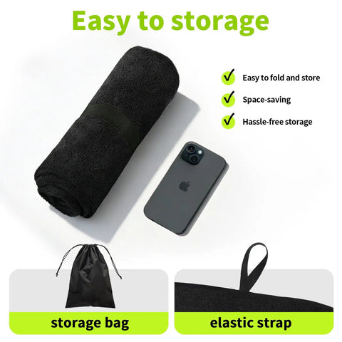 Black Waterproof Sweat Towel Seat Cover rolled with phone, storage bag, and elastic strap, ideal for workouts and outdoor activities.