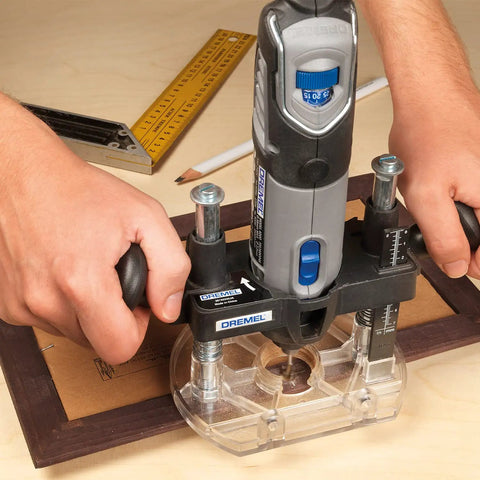 Bench Mounted Router Table Adapter For Corded Rotary Power Tools Featuring Six Hardened Steel Shaping Bits in use with Dremel tool.