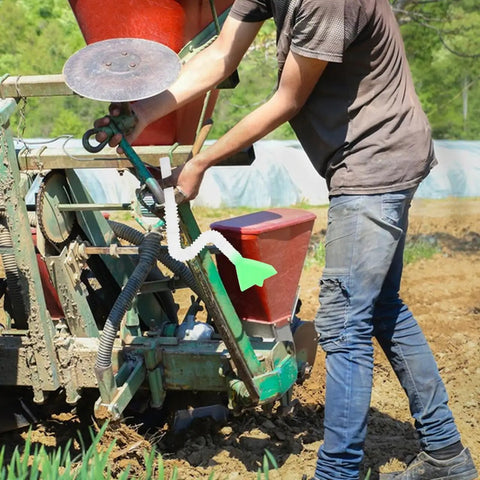 Efficient Seed Distribution Tube For Wheat And Corn Plastic Accessory With Wide Green Funnel Top attached to planter