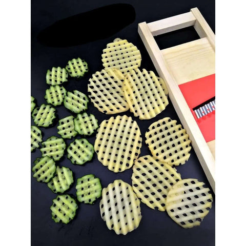 Wave Waffle Crinkle Cutter set: beige round lattice discs for potatoes; cucumber slices and a wooden box beside.