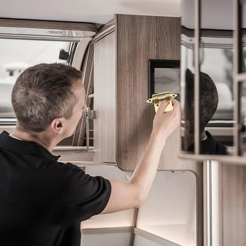 Person installing Spring Hinges With Semi Hidden Self Closing Action Heavy Duty Steel Door Closers for RV doors on a cabinet.