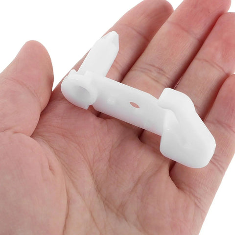 Awesome Fridge Door Stop Latch That Kills Noise And Stops Bumps With A Tough Plastic Clip held in a hand for perspective.
