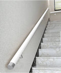 Rock Solid White PVC Safety Handrail Seventeen Feet Long with wall mount on stairs for added support and safety.