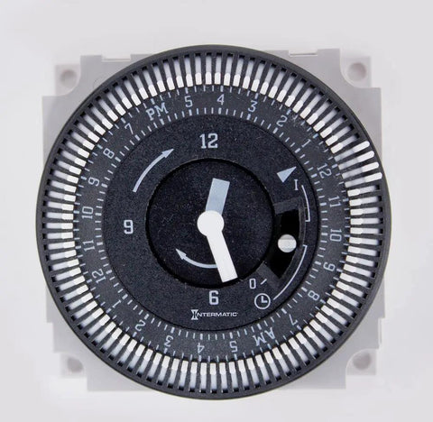 Close-up of 24-Hour Electromechanical Time Switch For Outdoor Use, showing 15-minute adjustable timer and industrial-grade dial.