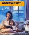 Mother and daughter reading with lit 16 color LED night light base, acrylic art display lamp in cozy bedroom setting.