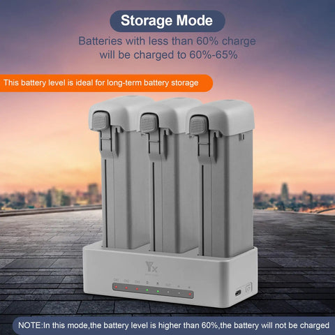 Two-Way Charging Hub For Avata 360 Drone with storage mode displaying three batteries and charge indicators in an outdoor setting.