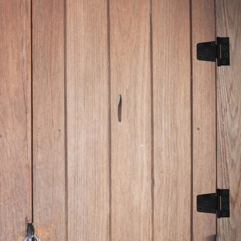 Wooden door with black heavy duty weld on gate hinge, shown open on right, for barn sheds fences and large doors, 3.5 inch size