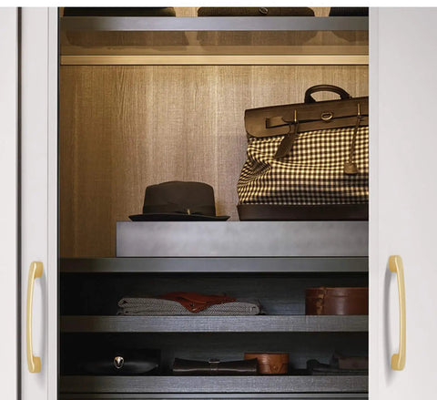 Top Shelf Heavy Gauge Zinc Alloy Cabinet Pulls Bow Handles set of two on a stylish cupboard with various accessories.