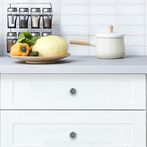 4 Pack Water Floral Cabinet Knobs 1.37 Inch Round White Drawer Pulls installed on kitchen drawers, front view