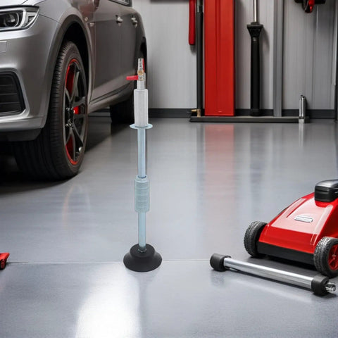Pneumatic Dent Puller Tool Kit For Car Repair With Heavy Duty Suction Cup Instant Dent Correction Vacuum Powered Dent Removal For Auto Body 23.97 X 4.72 Inch Portable Pro Grade Car Fix Kit next to a car wheel in garage