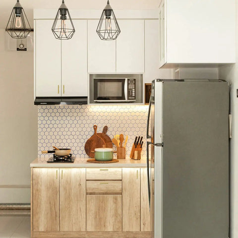 Modern kitchen with wooden cabinets, hexagon backsplash, and stainless steel appliances, including a fridge and microwave.