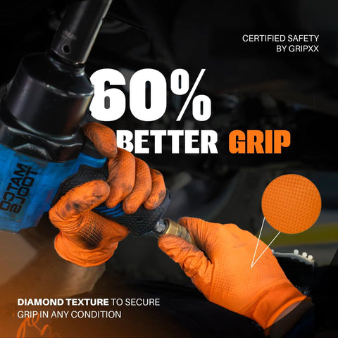 Hands wearing Ultra Thick 8 Mil Orange Nitrile Gloves With 3D Raised Diamond Texture working on machinery, showcasing grip.