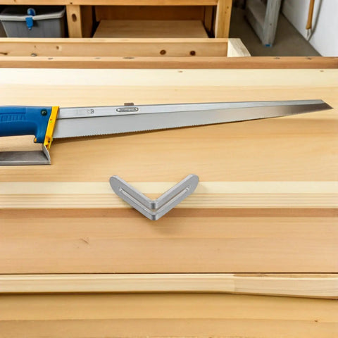 Stainless Steel L Shape Shelf Brackets For Wood Shelves And Tables Adjustable Slot Design next to a handsaw on a workbench.