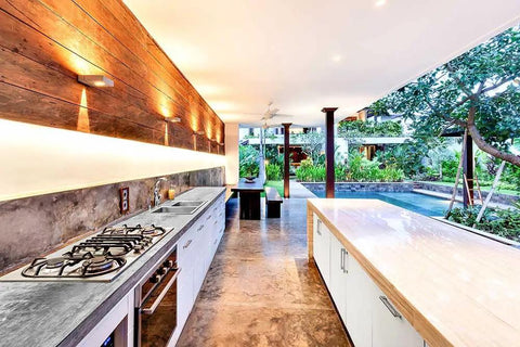 Top Shelf Pro Grade High Gloss Wet Look Concrete Sealer That Really Gonna Make Your Driveway Shine With Hard Hitting Protection And Deep Color Enhancement For A Solid Five Gallon Finish in modern outdoor kitchen with wooden accents.