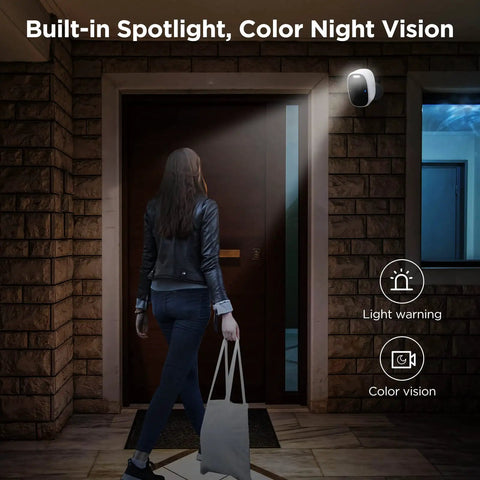 Wireless Outdoor Security Camera 2.5K Ultra HD with spotlight illuminating entrance, showcasing color night vision in action.
