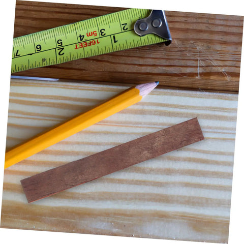 Top Shelf Wood Pen Blanks For Turning 8 Pack Exotic Lumber With Sick Rotating Grain Pattern Killer DIY Kit on wooden surface with measuring tape and pencil.