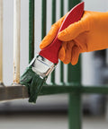 Orange Lightning Gloves OR-L Large Work-Ready used in painting, showcasing grip and dexterity in industrial tasks.