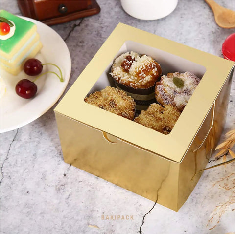 Premium Gold Bakery Boxes With Clear Window, 25 Pack Of 5x5x3.5 Inch Cake Containers holding assorted baked goods.