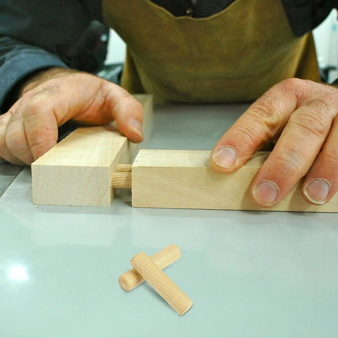 Pro Grade 500 Piece Wooden Dowel Pin Set With Fluted Beveled Hardwood Connectors used in woodworking assembly.