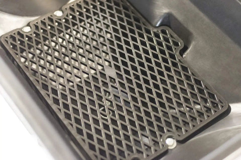 Black metal grate, part of 85 Lb Spreader Grate Kit For Push And Tow Spreaders, Pro Grade Upgrade That Improves Material Flow And Spreader Performance.