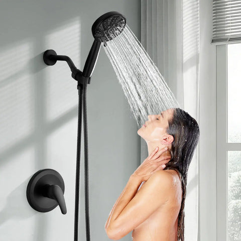 Heavy Duty Matte Black Shower Faucet Set With Integrated Pressure Balance Valve And Versatile Six Setting Handheld Sprayer Smooth Hookup For Major Home Refresh in use with water flowing.