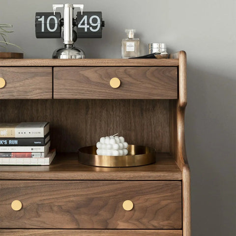 Wooden dresser with Solid Brass Round Cabinet Knobs 4 Pack, beefy yet sleek dresser drawer pulls installed on drawers.