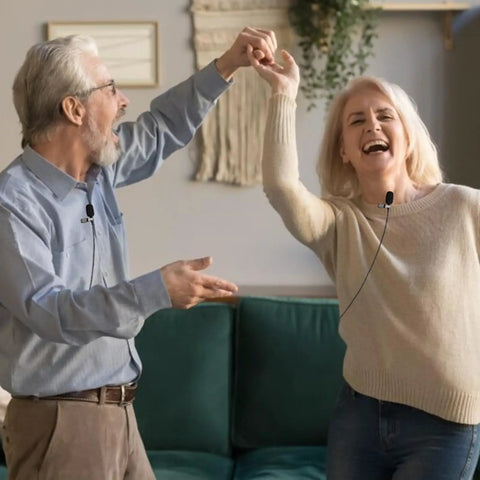 Couple dancing with Lavalier Lapel Microphone With Unidirectional Cardioid Condenser For Shure Wireless Bodypack Transmitter Systems Mini XLR TA4F Plug, clipped to clothing for clear voice quality.