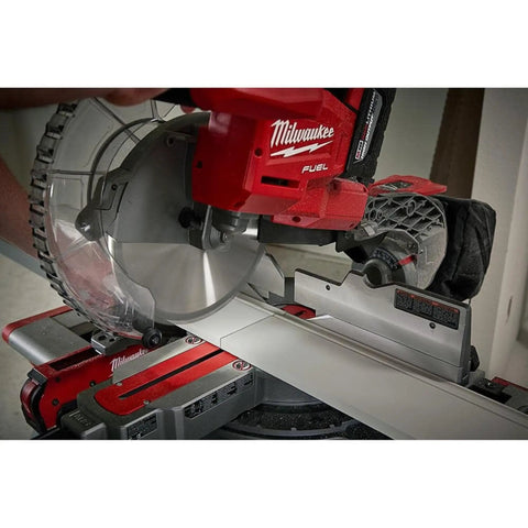 Close-up of Top Tier Dual Bevel Sliding Compound Miter Saw With Brushless Powerplant cutting a 10 inch board.