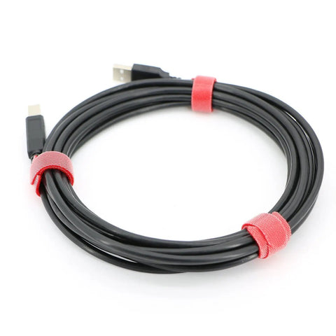 Black cable wrapped with red 8-inch reusable hook-and-loop ties, shown in a tidy coil. 100 Pack Reusable Hook And Loop Cable Ties 8 Inch Long.