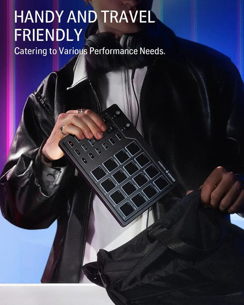 Person holding a Studio Grade MIDI Pad Beat Maker Drum Machine With 16 Backlit Pads, 3 Pad Banks, handy and travel-friendly.