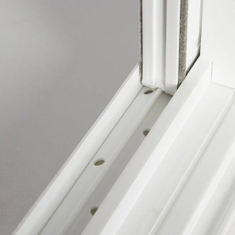 Close-up of Vinyl Basement Slider Window 32 By 18 Inches White Built Tough With Heavy Duty Welded Sash And Main Frame For Easy Glide