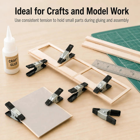 Straight Up Kicking 40 Pack Mini Spring Clamps Heavy Duty Nickel Plated Steel Clips holding wood during craft assembly.