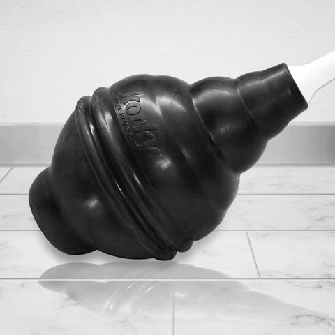 Heavy Duty Toilet Plunger Featuring Signature Beehive Shape And Drip Free Carry Handle That Blasts Away Stubborn Clogs Quick On Any Toilet Model Crafted From Durable Rubber For Serious Hold And Zero Fuss Household Use, shown at an angle on tiled floor.