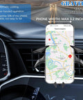 Bat Wings Car Phone Holder With Universal Air Vent Mount and Mechanical Wing Design For Ultra Stable Hands Free Phone Access On The Road positioned in car air vent, holding phone with map visible.