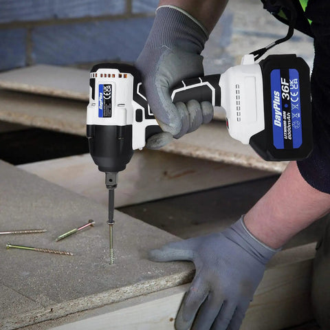 Person using Get Your Hands On This Badass 21V Cordless Impact Wrench With Brushless Motor on screws in a workshop.