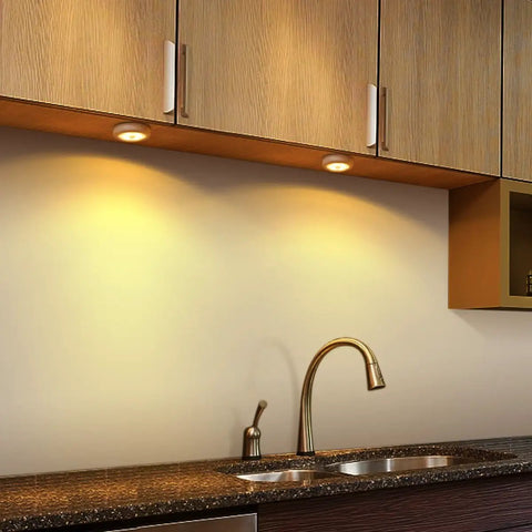 Under cabinet kitchen view with warm light from Upgraded 3.15 Inch Wireless Motion Sensor Light Cordless Battery Powered No Wires Needed Stick On LED Night Light For Closet Stair Hallway Under Cabinet And Kitchen Warm White Pack Of 3.