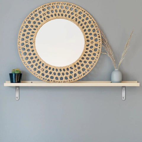 Heavy Duty Stainless Steel L Shaped Shelf Brackets 10 Pack With Pre Drilled Holes And Screws installed on wooden shelf with decor