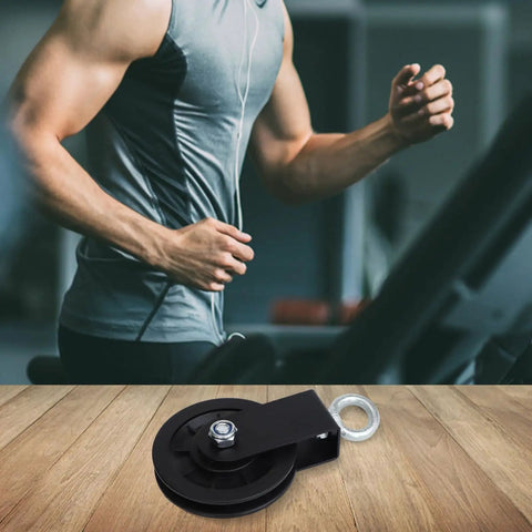88mm Cable Pulley Wheel For Home Gym System Hard Nylon Lifting Wheel in front of a man exercising on treadmill