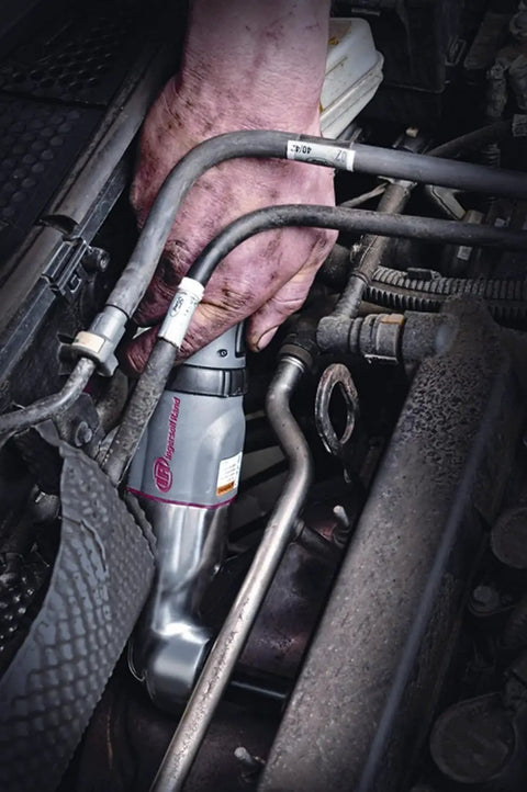 Pro Grade 1/2 Inch Air Impact Wrench Delivers Beast Mode 180 Ft Lb Max Torque used in tight engine space for repairs.