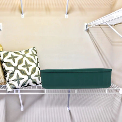 Heavy Duty Underwear Storage Box With Secure Lid Rock Solid Sock And Sleepwear Drawer Organizer on a shelf with pillows.