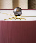 Top detail of Torino Table Lamp With Ceramic Multicolor Squares Finish, showcasing brown tapered drum shade fitting.