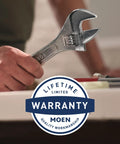 Close-up of hand holding a wrench near Brecklyn Mediterranean Bronze Single Handle Pull Out Sprayer Kitchen Faucet With Power Clean Tech.