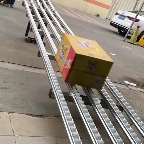 Heavy Duty 40cm X 250cm Plastic Loading Roller For Warehouse Unloading Pulley And Reliable Conveyor Solution With Durable Transport Equipment For Freight Handling Workflow moving a package down a sloped conveyor.
