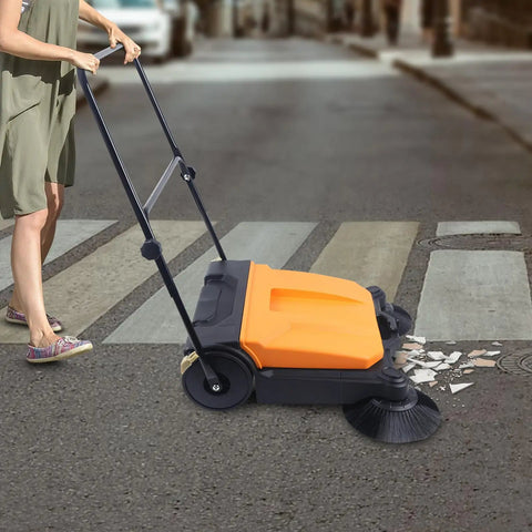 Heavy Duty 26 Inch Walk Behind Floor Sweeper With Foldable Handle And Sturdy Nylon Brushes For Durable Home Garage Cleaning Use No Electricity Needed Easy Maneuver Sweep on street clearing debris.