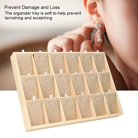 Hella Durable Pine Wood Jewelry Tray With Eighteen Secure Slots For Countertop Display Storage showcasing earrings in organized slots.