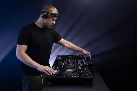 DJ using Four Deck All In One DJ System With A 10.1 Inch Touchscreen Built In Wi Fi SonicLink Wireless Tech Performance Pads And Beat FX