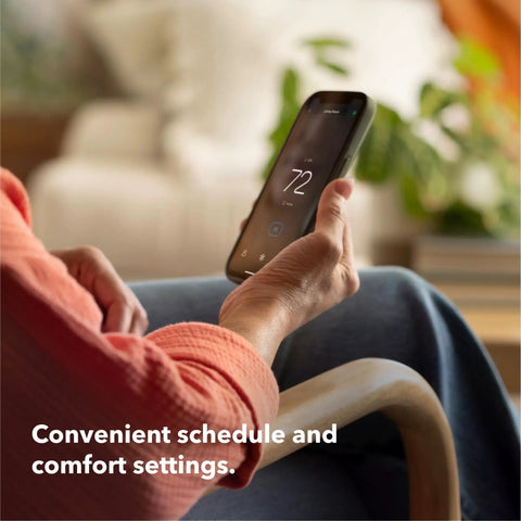 Person adjusting Energy Star Certified Programmable WiFi Thermostat That Works With Siri, Alexa And Google Assistant via smartphone app