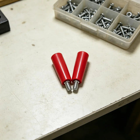 Durable 2-Piece M10x80 Revolving Crank Handle For Lathe And Milling Machines With Smooth Red Bakelite Grip and Iron Build on workbench.